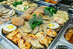 A set of meat dishes in the trays