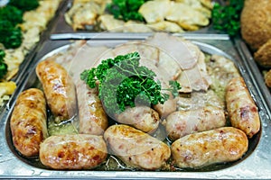 A set of meat dishes in the trays