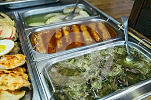 A set of meat dishes in the trays