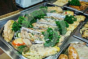 A set of meat dishes in the trays