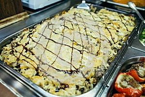 A set of meat dishes in the trays