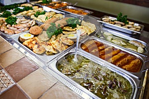 A set of meat dishes in the trays