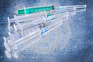 Set of medical disposable injectors on metallic background medic