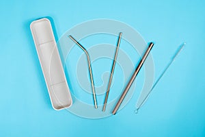 A set of metal drinking straws and a box