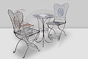 Set of metal garden furniture, table and three chairs photo