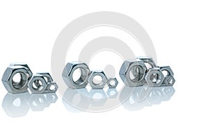 Set of metal hexagon nuts isolated on white background. Small, medium, and big of silver metal hexagon nuts. Hardware tool.