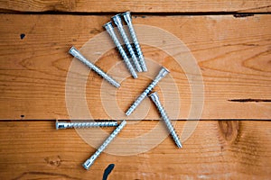 Set of metalware on the wooden background photo