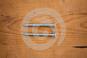 Set of metalware on the wooden background photo
