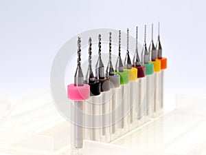 Set of micro drill bits, color coded in plastic box