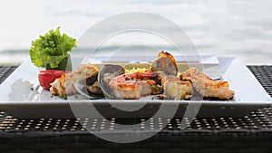 Set of mixed delicious seafood with tasty cooked prawns, charcoal grilled mussel