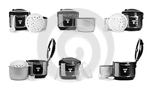 Set of modern electric multi cookers, parts and accessories on white