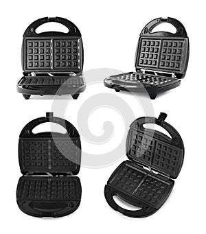 Set with modern electric waffle makers on background