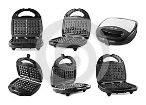 Set with modern electric waffle makers on background