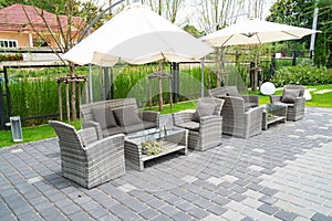 set modern furniture rattan armchairs and table in garden ,outdoor