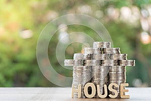 Set money Coin, shaped like a house and house text. With green background, financial concept