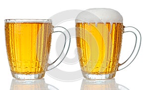 Set of mugs of cold light beer