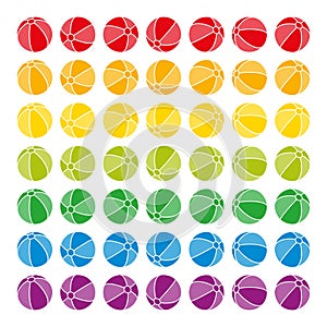 Set of multi colored beach balls, aligned in different directions photo