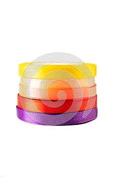 set of multi-colored satin ribbons for gifts on white background