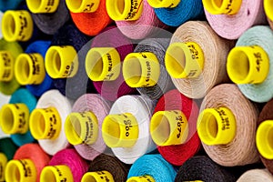 Set of multi-colored spools of thread for sewing