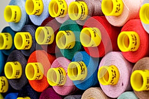 Set of multi-colored spools of thread for sewing
