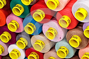 Set of multi-colored spools of thread for sewing