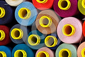 Set of multi-colored spools of thread for sewing