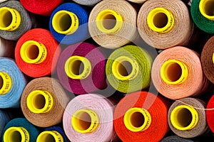 Set of multi-colored spools of thread for sewing