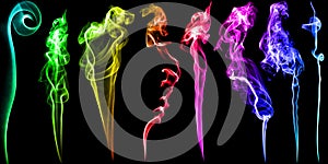 Set of multicolored fume and smoke on black background