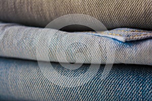 Set of multicolored jeans as pattern or background with selectiv