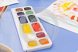 Set of multicolored watercolor paints, childrens drawing