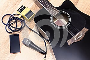 Set of music objects with black accoustic guitar, microphone, mobile music