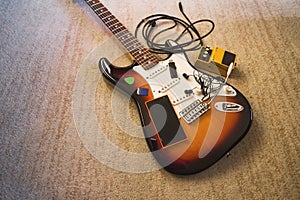 Set of music objects on electric single guitar, wide angle