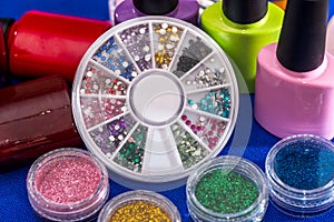 Set of nail glitters and polish nail of different colors