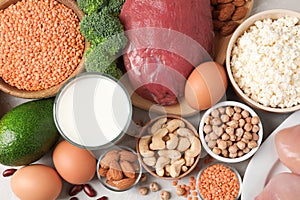 Set of natural food high in protein on grey background