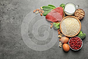 Set of natural food high in protein and space for text on grey background