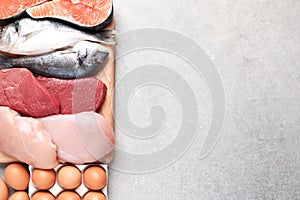 Set of natural food high in protein and space for text on grey background