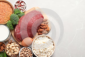 Set of natural food high in protein and space for text on light background