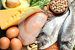 Set of natural food high in protein on wooden background