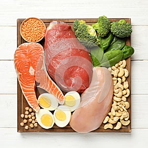 Set of natural food high in protein on wooden background