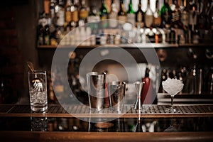 Set of necesary barman equipment on the bar counter