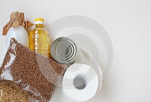 Set of necessary products in quarantine period, cereals, milk, sunflower oil, canned food, pasta and toilet paper