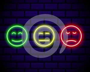 Set of neon smile emoticons isolated on dark brick wall background. Line icons. Happy and unhappy smileys. Emoji set. Colours