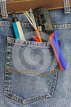 Set of network instruments in a back pocket of jeans
