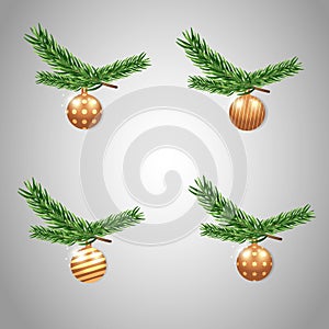 A set of New Year\'s Eve gold balloons hangs on the branch of the Christmas tree. Decoration