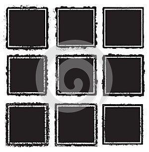 Set of nine grunge square white frames  on a black background