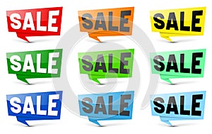 Set of nine varicolored SALE signs with shadows on white background photo