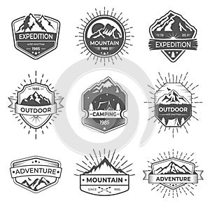 Set of nine vector mountain and outdoor adventures logo. Logotype templates and badges with mountains, trees, tent