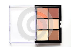 Set of nude eyeshadows in black case on white background. Top view , copy space