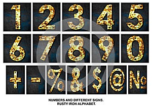 Set, numbers, and signs. Alphabet from digit, from rusty iron, on a wooden plank. Isolated on white background