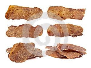 Set og jerky isolate. Pieces of cured pork isolated on white background. Portion of dried pork on white background.